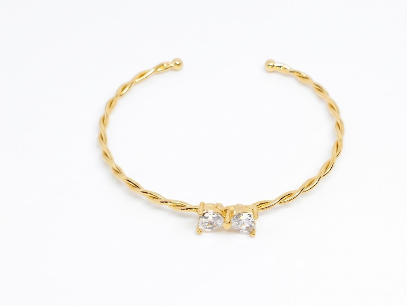 Bracelete Torcido com Gotas Centrais em Zircônia